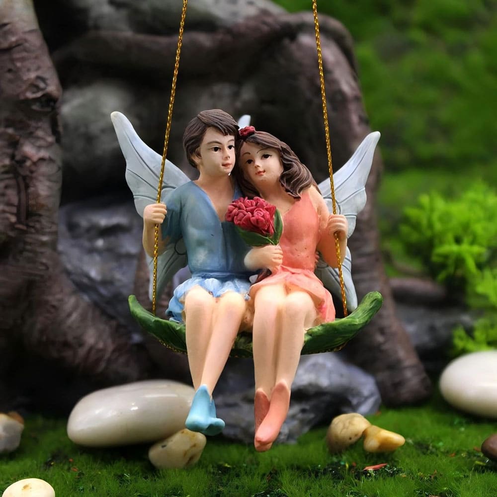 romantic fairy couple on a swing