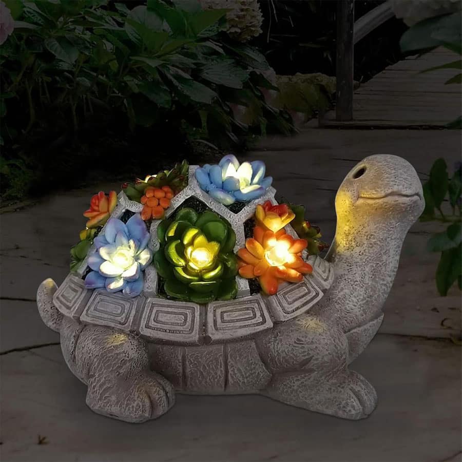 magical turtle statue with floral lights