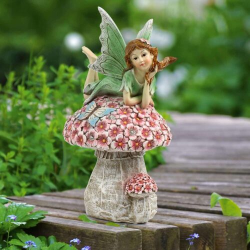 solar powered fairy resting on a mushroom