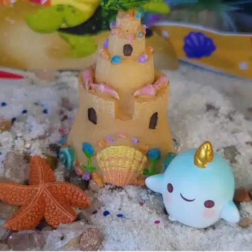 mermaid beach sand castle with blue baby unicorn whale
