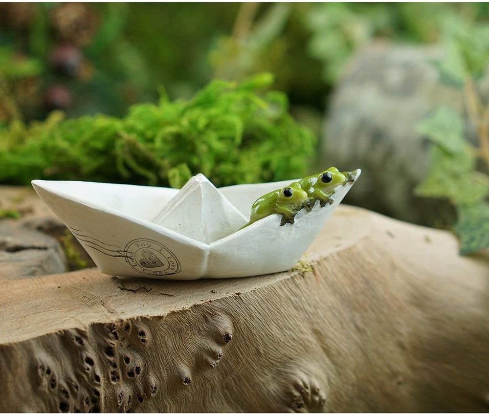 adventurous frogs on a paper boat3